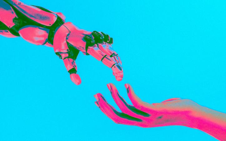 Pink and green robot hand reaching toward a human hand against a cyan background